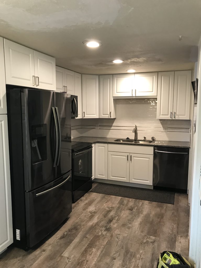 Remodeled Kitchen With White Cabinets